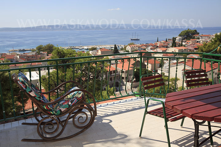 chair on balcony with panorama on Baska Voda