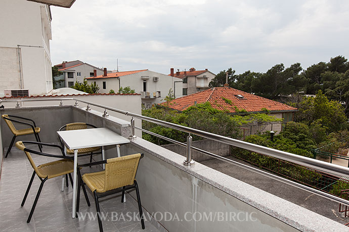 large balcony with partial seaview